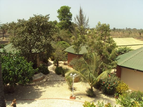 An overview of the lodges to show how we have introduced many more trees and vegetation to enhance habitats for wildlife and the enjoyment of guests. The buildings blend in unobtrusively by using green roofing materials and by painting walls in earth colours.