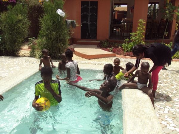 5g: Here are the children enjoying the pool at the end of our season. This is a much anticipated event for them all. We have a feast first and, after the swimming, we all go to the local beach for a barbeque as a way of thanking staff and family alike for their support.